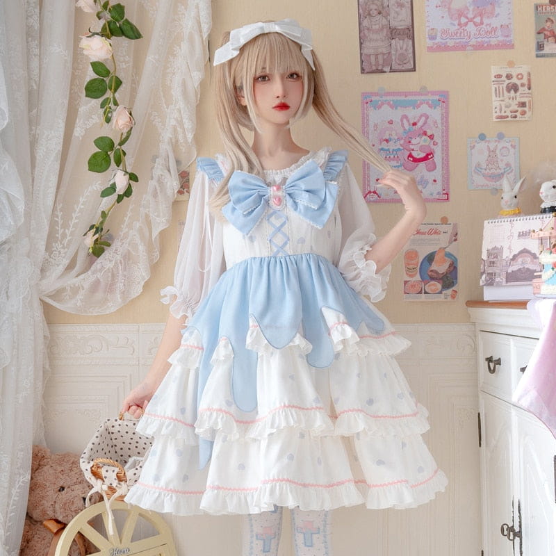 Pastel blue and white ruffle jumper dress with bows and a full layered skirt