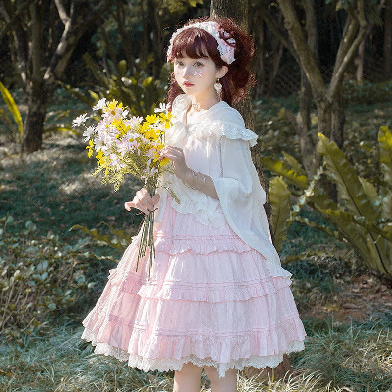 Pink ruffle princess dress with lace tiers and a full petticoat silhouette