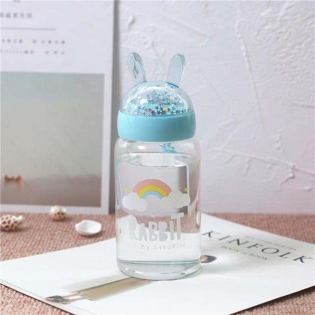 https://kawaiibabe.com/cdn/shop/products/glitter-bunny-bottles-blue-rainbow-belly-tops-rabbit-cry-babies-baby-crybabies-shirt-ddlg-playground_570_800x.jpg?v=1571610648